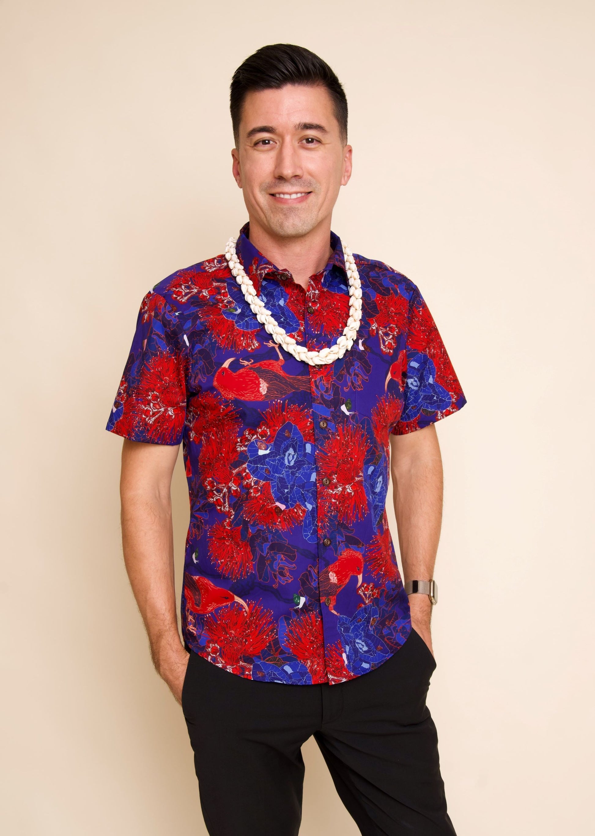 Man wears Blue & Red Men's Aloha Shirt