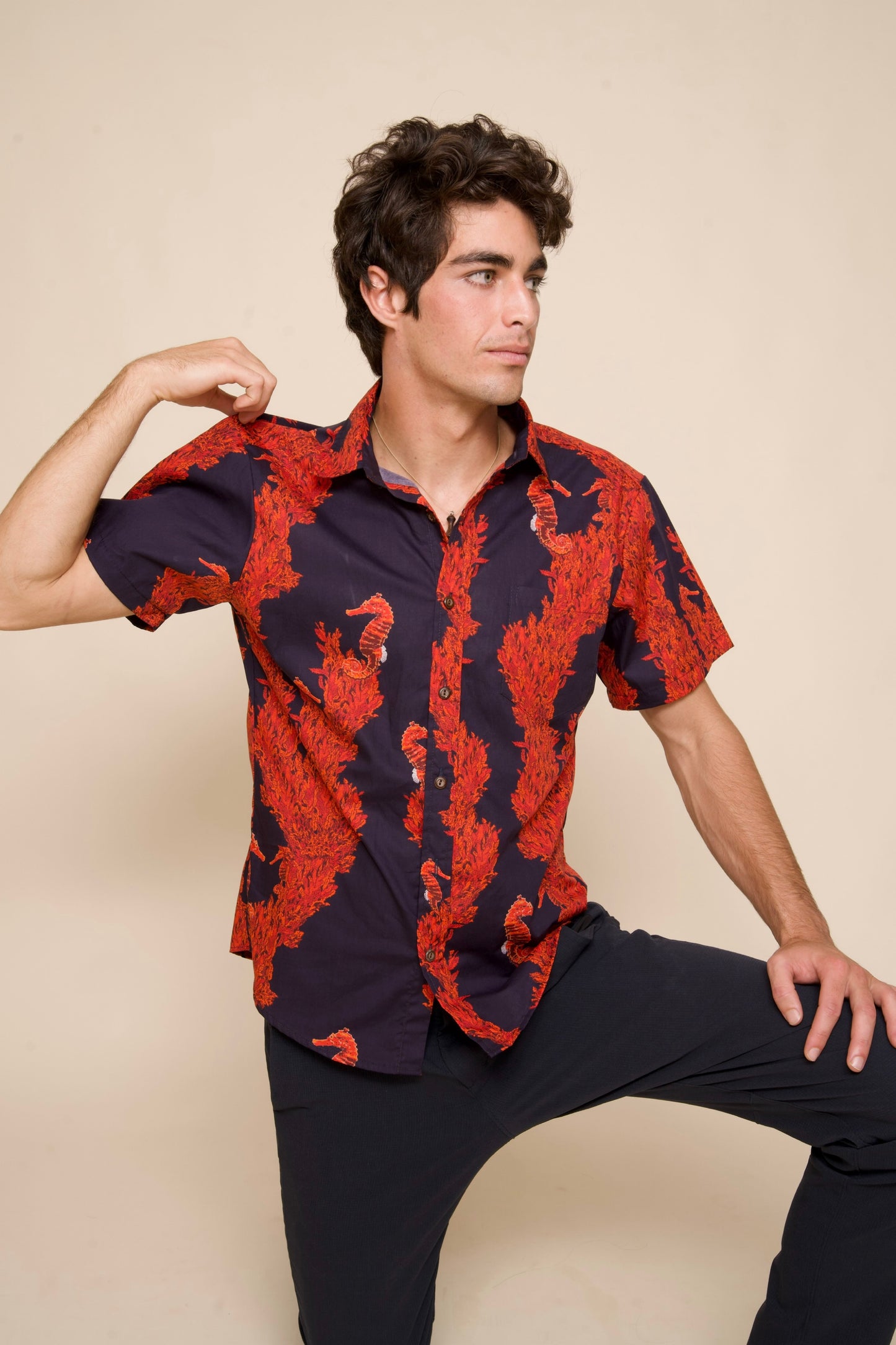 Man wears Mens Red and Black Aloha Shirt